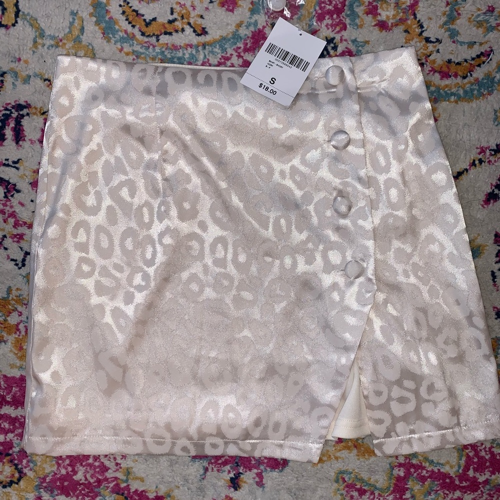 NEVER WORN WITH TAGS  Ivory cheetah print skirt!